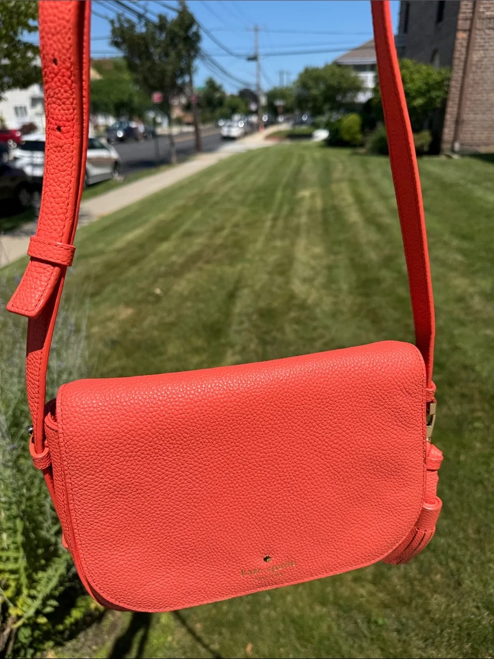 kate spade coral orange pebbled leather crossbody with tassels
